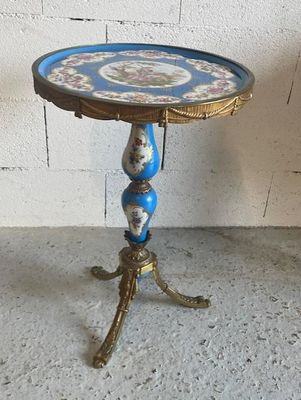 a small table with a blue and gold design on it
