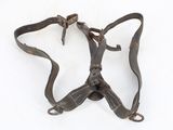 an old pair of leather harnesses on a white surface
