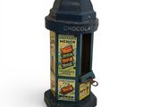 a blue and black fire hydrant with chocolate labels on it