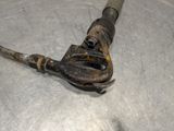 a close up of a rusty pipe cutter on a metal surface