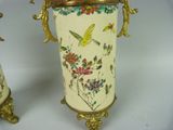two vases that are decorated with birds and flowers