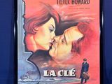 an old movie poster of a man kissing a woman in front of a blue background