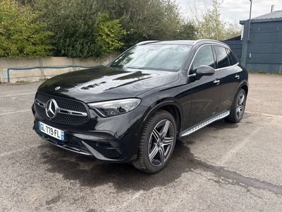 the mercedes gle suv is parked in a parking lot