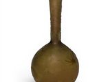a brown vase that is sitting on a white surface