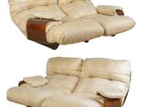 pair of cream colored reclining chairs with wooden arms and foot rests