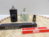 a bottle of perfume and a box of perfume on a tray