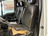 a van that has been vandalized and is sitting in the garage