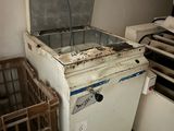 an old refrigerator that is sitting in a room