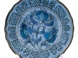 an image of a blue and white plate with flowers on it