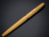 a wooden pen on a black background