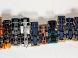 many toy cars that are lined up on the wall