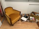 a chair and a laptop on the floor next to a window