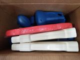 a cardboard box filled with different types of toothbrushes