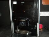 a coffee machine sitting on a counter in a kitchen