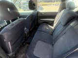 the back seats of a car are empty in the parking lot