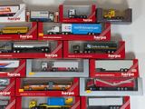 a lot of toy trucks that are in the box