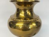 an image of a gold lamp on a white background with a cord