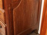 a dresser with a mirror on top of it in a room