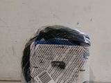 a bag of black and white yarn on a table