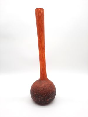 a wooden vase that is sitting on a white surface
