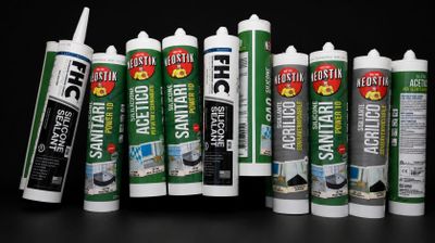 several different types of construction adhesives are lined up against a black background