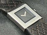a close up of a wrist watch on a black surface