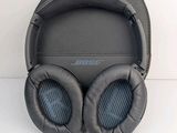 the bose bluetooth headphones are sitting on a white surface