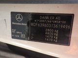 the back end of a mercedes benz car with a sticker on it ' s bumper