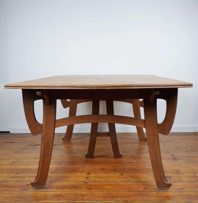 a wooden table sitting on top of a hard wood floor