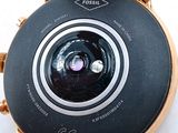 a close up of a wrist watch with a camera attached to it