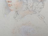 portrait of a woman with curly hair in a white dress