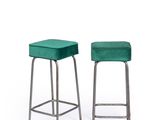 a pair of green velvet stools on a white background
