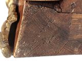 a close up of a piece of wood with a clock on it