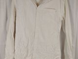a white shirt hanging on a white curtain with a black hanger