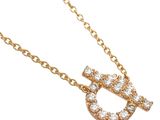 a close up of a diamond initial necklace on a gold chain