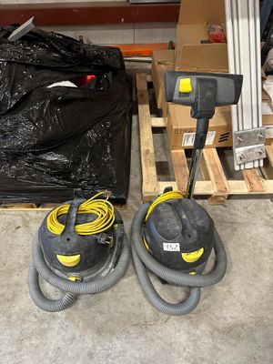 two vacuums that are sitting on a pallet