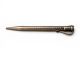 a pen with a metal tip sitting on top of a white surface