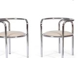 pair of chrome steel and leather armchairs with arms