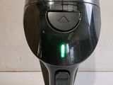an image of a close up of a device with a green light