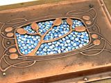a picture of a decorative box with blue stones in it