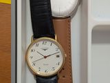 two watches sitting in a box on a table