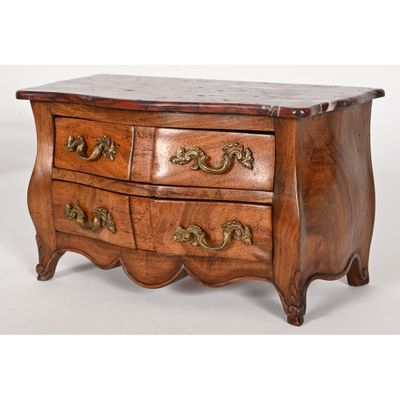 an image of a wooden chest of drawers with a marble top