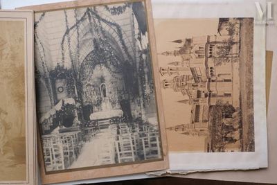 several old photographs of people in a church are on a table
