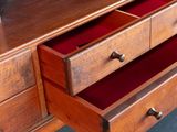 a wooden desk with two drawers and a bookcase