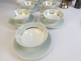 a white table with a lot of plates and cups on it