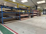 a large warehouse filled with lots of shelves and pallets