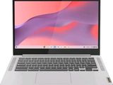 une image représentant un ordinateur portable blanc posé sur une surface blanche