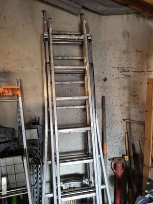 a ladder leaning up against a wall in a garage