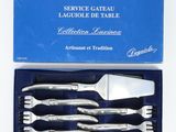 silverware in a blue box on a white surface
