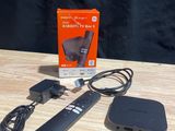 an image of a box with a remote and a charger on a table